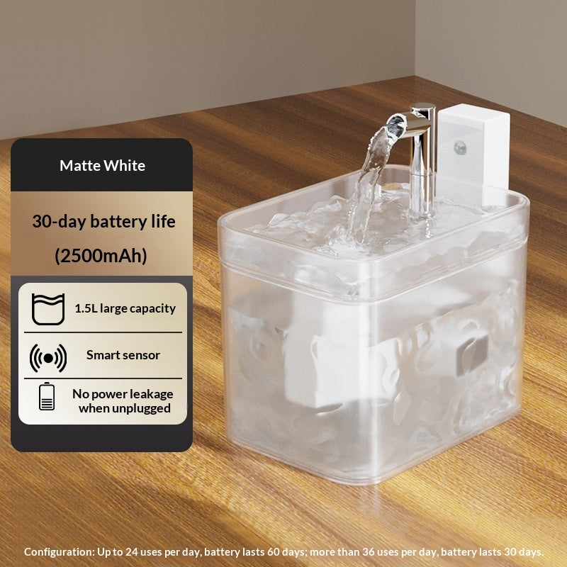Clear water fountain on a wooden surface with features listed on a card.