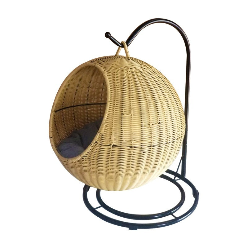 Wicker hanging chair on a stand with a white background
