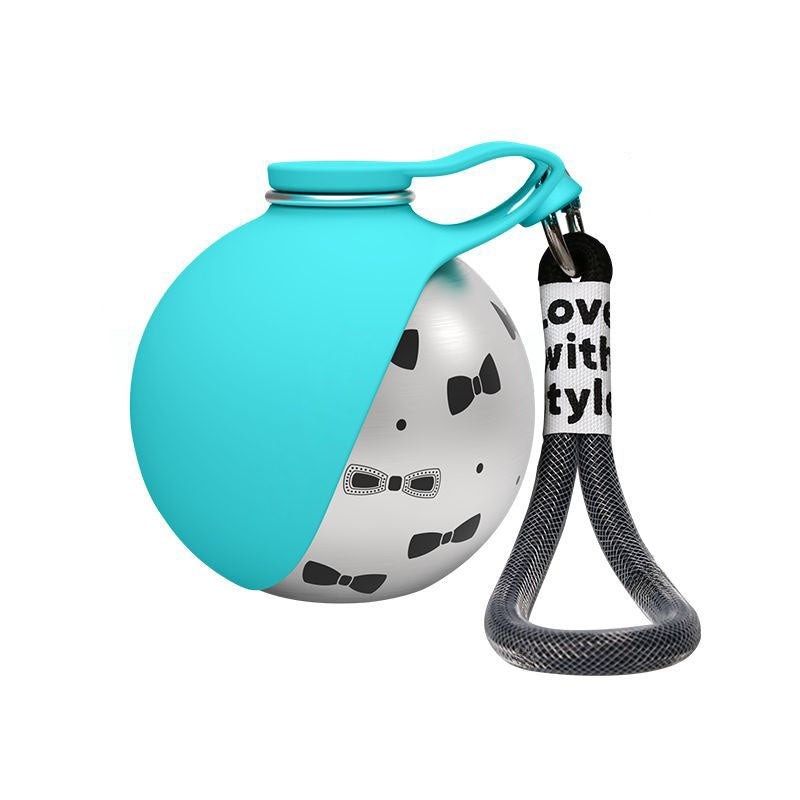 Pet toy with a blue top and black and white design on a white background