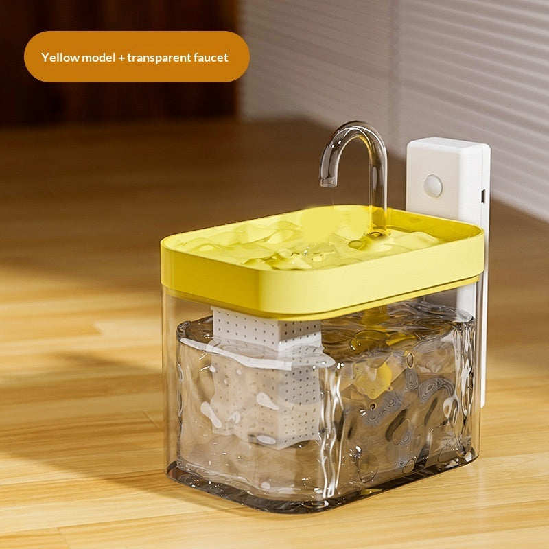Yellow model with transparent faucet on a wooden surface