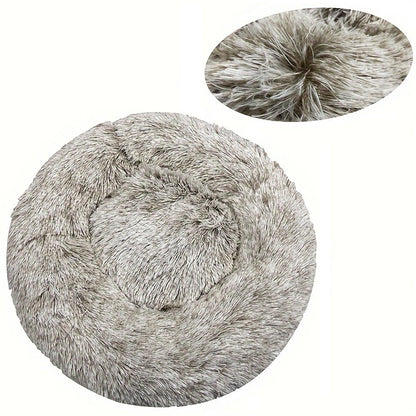Round fluffy pet bed with close-up of texture on a white background