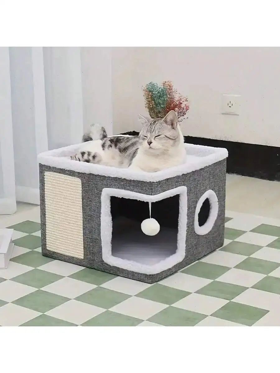 Cat lying on a gray and white cat tree with a checkered floor and plant in the background