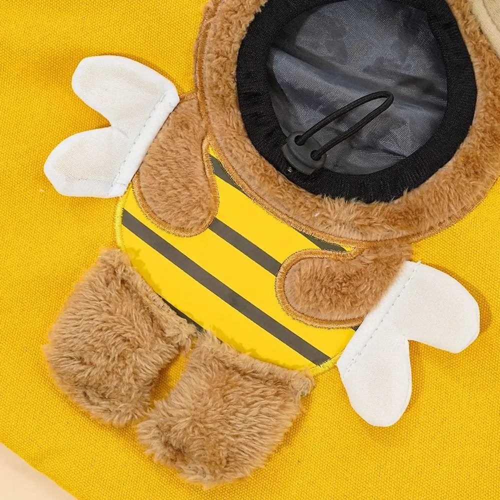 Bee-themed costume with yellow body, brown wings, and black stripes on a yellow background