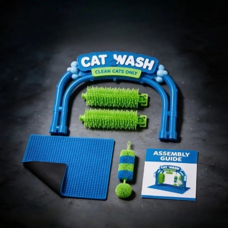 A cat wash toy set laid out on a dark surface, including a blue arch frame, two green cleaning brushes, a blue scrubbing pad, a small blue-and-green brush attachment, and an assembly guide card.