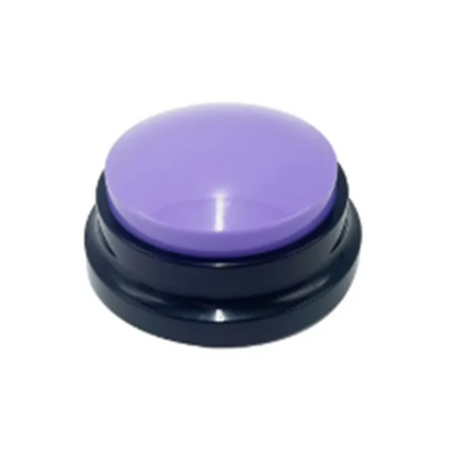 Round purple button with black base on a white background