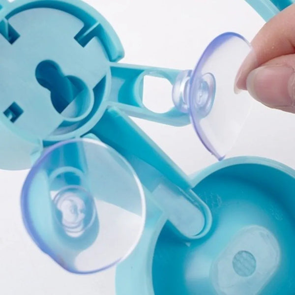 Close-up of a blue silicone ice cube tray with suction cups on a white background