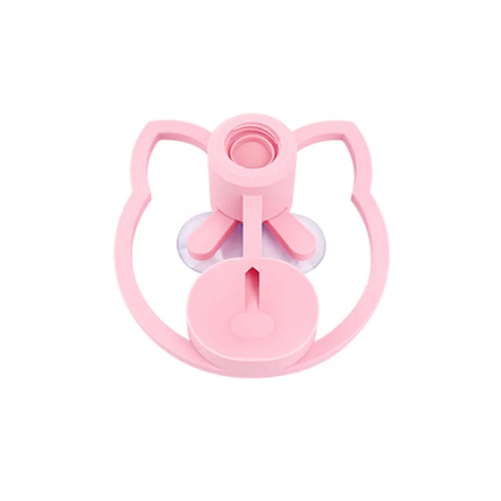 Pink baby bottle lid with a unique design on a white background