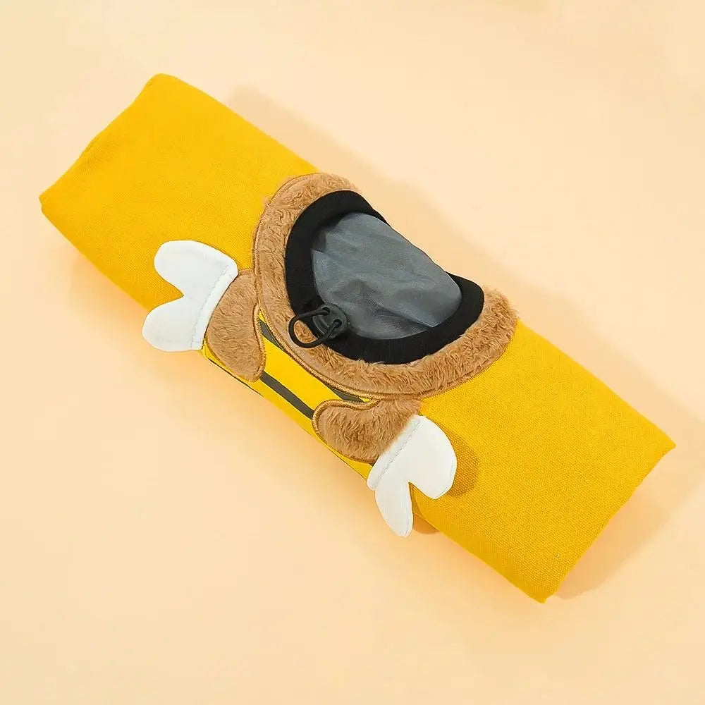 Yellow pouch with a bear face design on a beige background