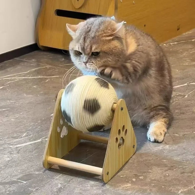 Cat playing with a wooden toy on a marble floor