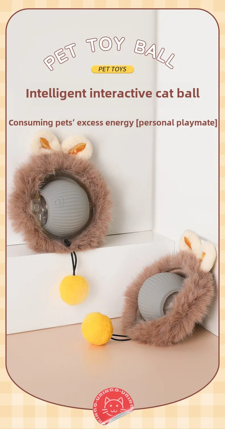 Intelligent interactive cat toy ball with fluffy brown exterior and yellow ball on a light wooden surface.