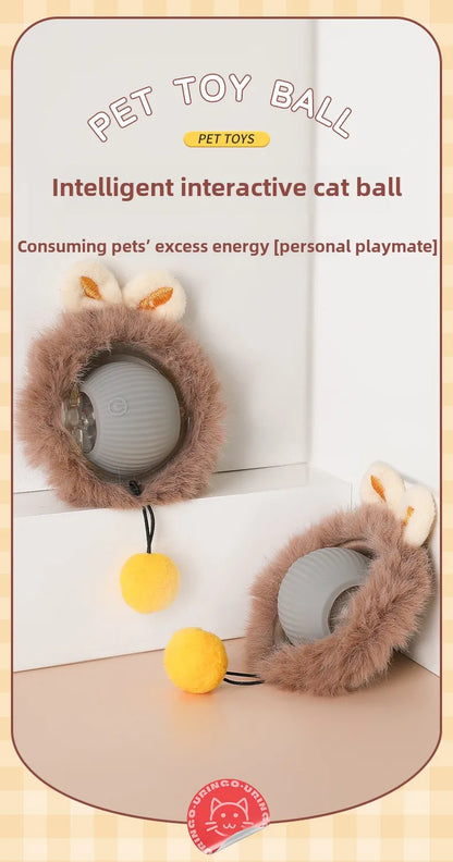 Intelligent interactive cat toy ball with fluffy brown exterior and yellow ball on a light wooden surface.