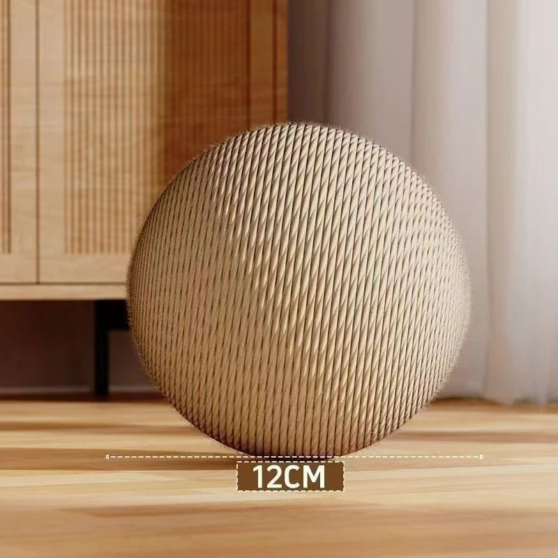 Round woven object on a wooden surface with a measurement label indicating 12cm.