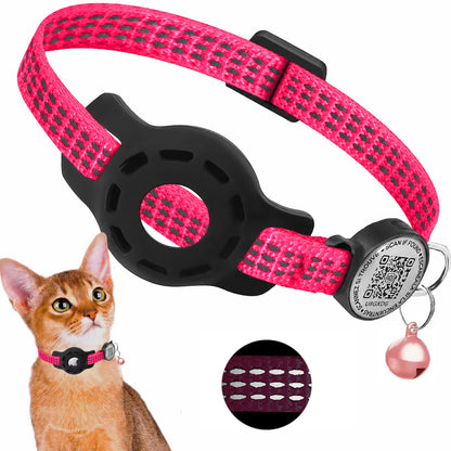 A pink and black reflective cat collar with a black plastic buckle and a small pink bell, shown on a white background with a small cat inset and a circular close-up detail.