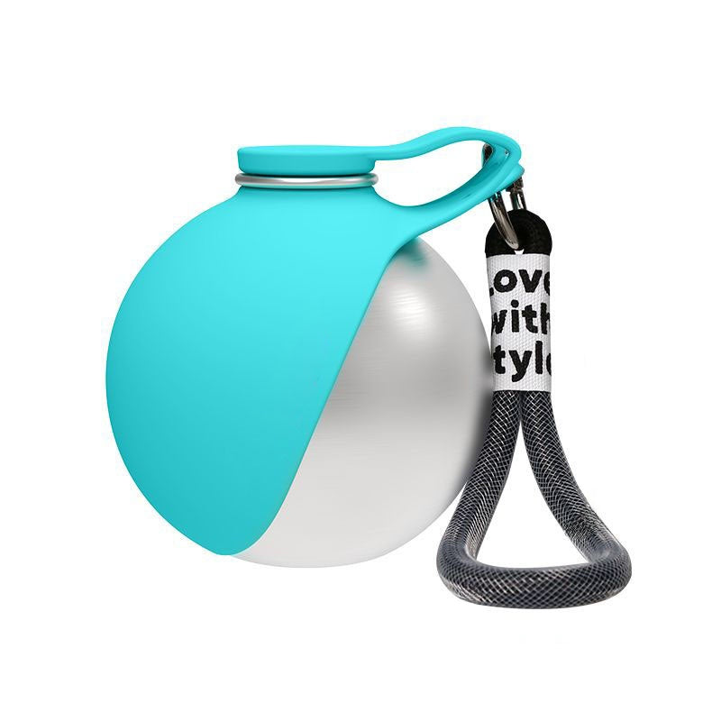 Turquoise and white dog toy with a rope on a white background