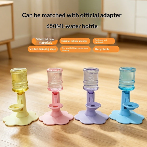 Four reusable water bottle adapters in pastel yellow, pink, lavender, and blue, arranged on a wooden floor with promotional text above.