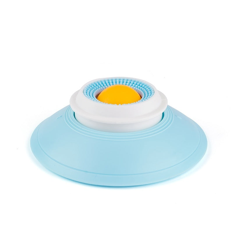 Blue and white suction cup with a yellow center on a white background
